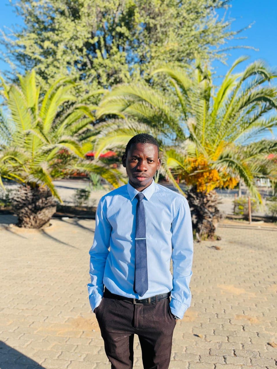 Kudumo Kupembona Andreas in a formal outdoor portrait