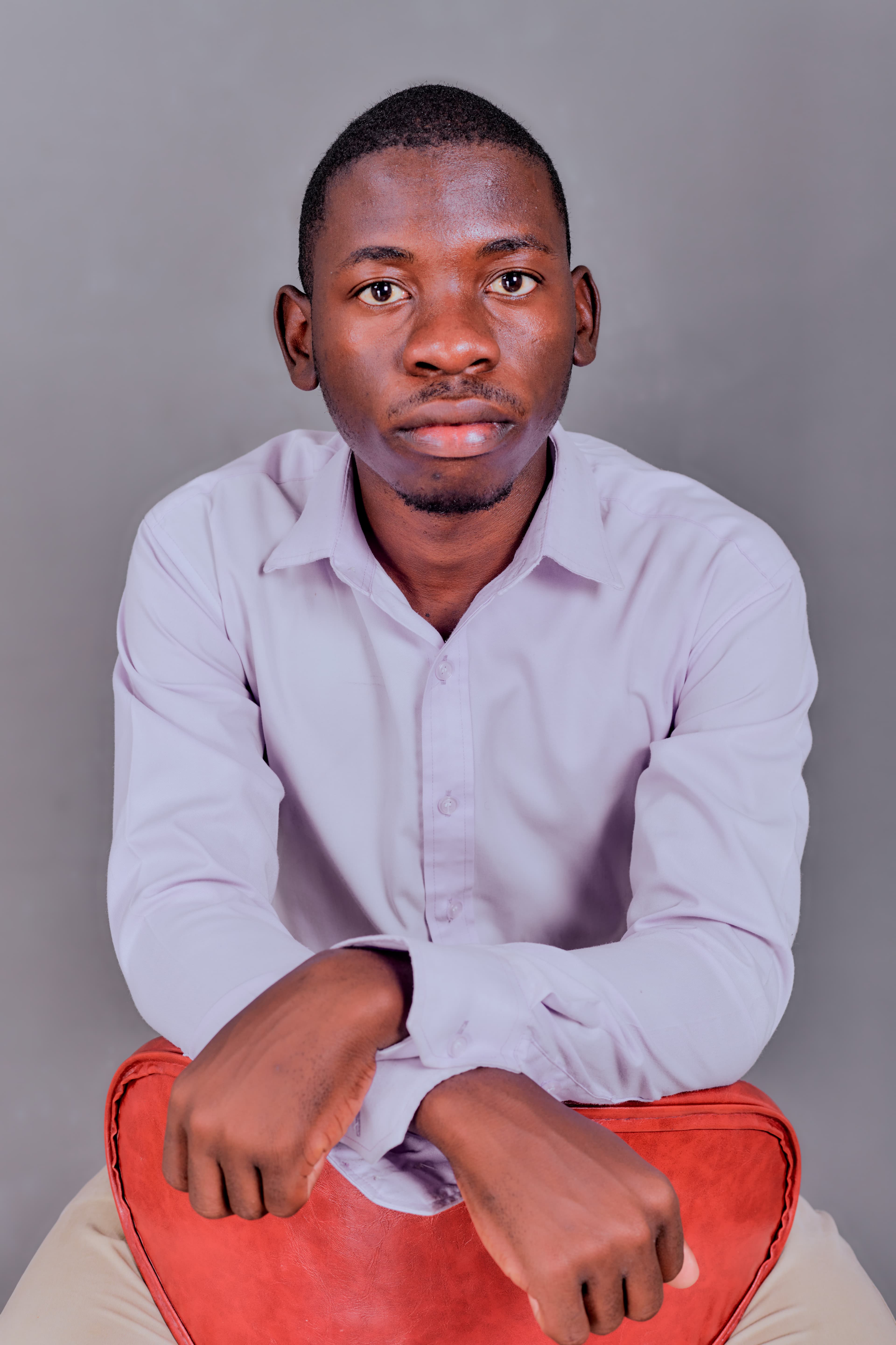 Kudumo Kupembona Andreas seated in a studio portrait